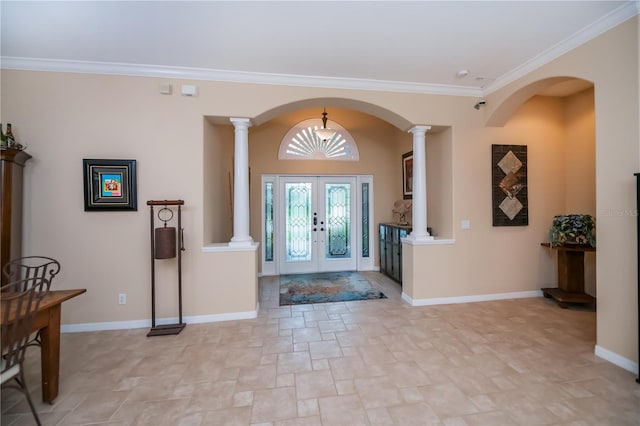 1062 Eagles Flight Way, North Port, FL 34287 - entrance foyer featuring stone finish flooring, decorative columns, ornamental molding, baseboards, and arched walkways