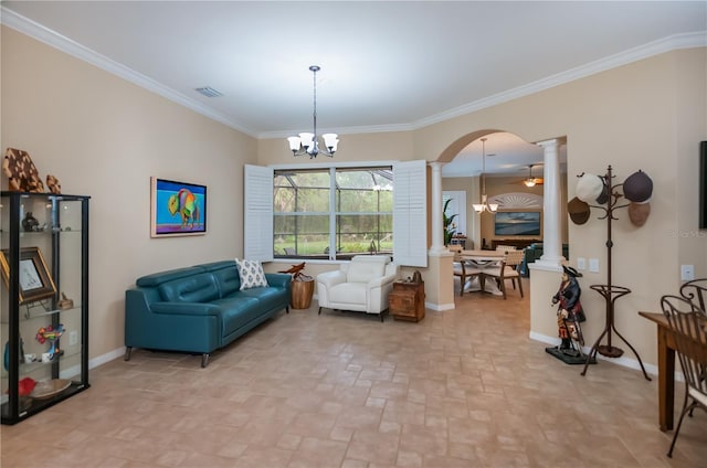 1062 Eagles Flight Way, North Port, FL 34287 - living room with decorative columns, a chandelier, arched walkways, baseboards, and crown molding