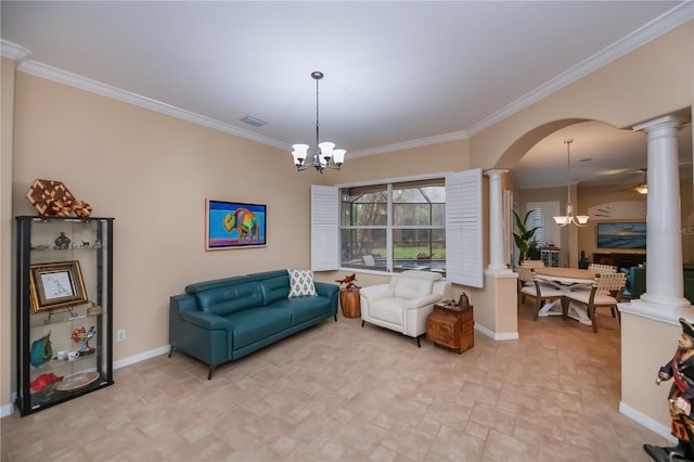 1062 Eagles Flight Way, North Port, FL 34287 - living area with ornate columns, a chandelier, arched walkways, stone finish flooring, and baseboards