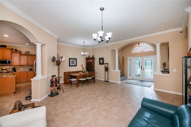 1062 Eagles Flight Way, North Port, FL 34287 - living area with decorative columns, arched walkways, baseboards, ornamental molding, and recessed lighting