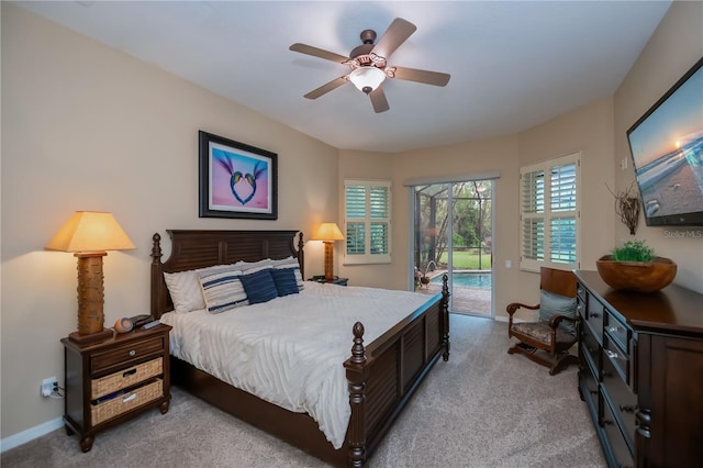 1062 Eagles Flight Way, North Port, FL 34287 - bedroom with access to outside, light colored carpet, baseboards, and a ceiling fan