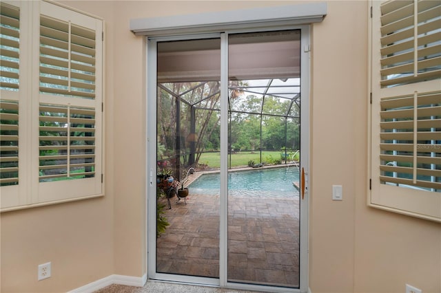 1062 Eagles Flight Way, North Port, FL 34287 - doorway to outside with a sunroom and baseboards
