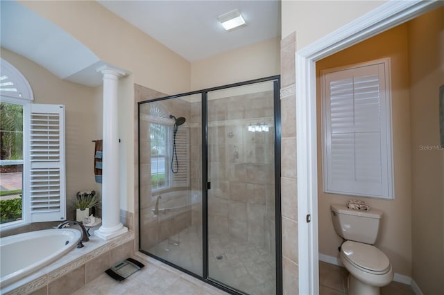 1062 Eagles Flight Way, North Port, FL 34287 - full bath featuring decorative columns, plenty of natural light, a garden tub, and a stall shower