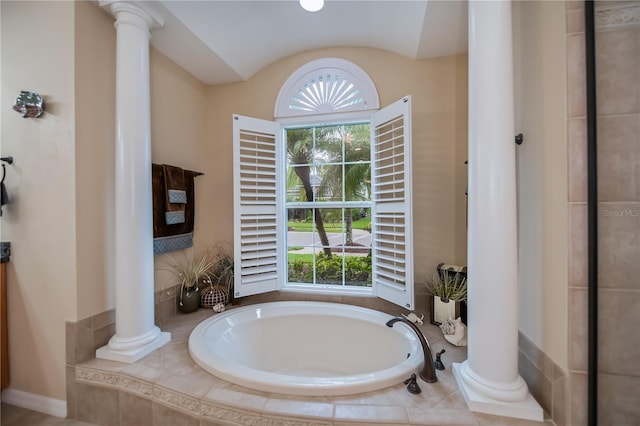 1062 Eagles Flight Way, North Port, FL 34287 - bathroom with decorative columns and a bath
