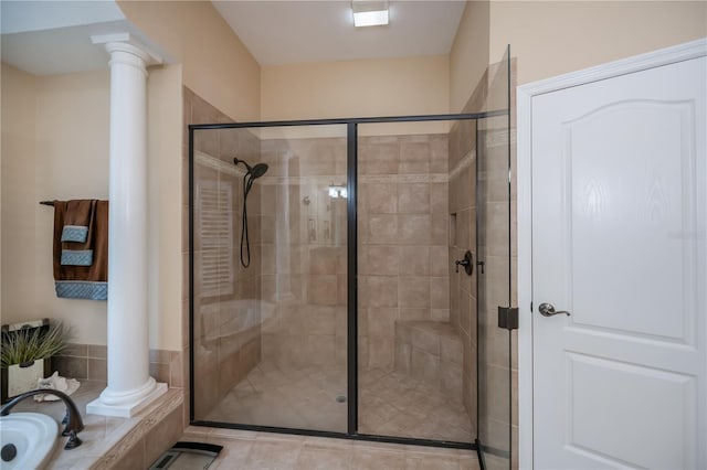 1062 Eagles Flight Way, North Port, FL 34287 - bathroom with decorative columns, a shower stall, and a relaxing tiled tub