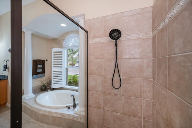 1062 Eagles Flight Way, North Port, FL 34287 - bathroom featuring ornate columns, tiled shower, a bath, and vanity