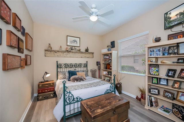 1062 Eagles Flight Way, North Port, FL 34287 - bedroom featuring baseboards, wood finished floors, and a ceiling fan