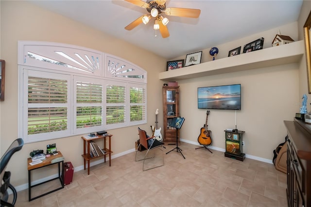 1062 Eagles Flight Way, North Port, FL 34287 - living area featuring ceiling fan, baseboards, and stone finish flooring