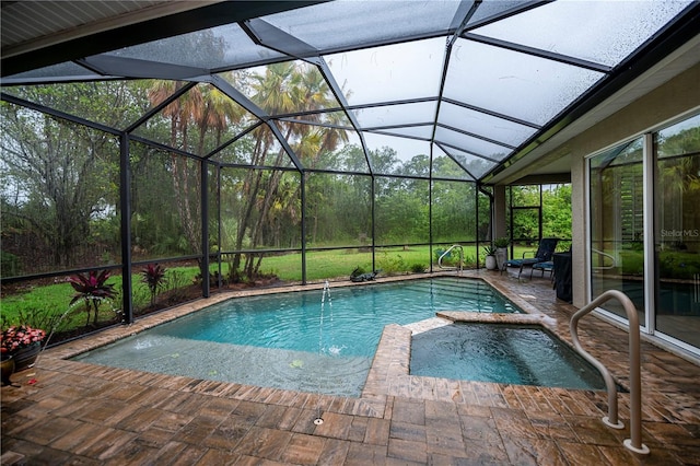 1062 Eagles Flight Way, North Port, FL 34287 - view of pool featuring a pool with connected hot tub, a patio area, and glass enclosure
