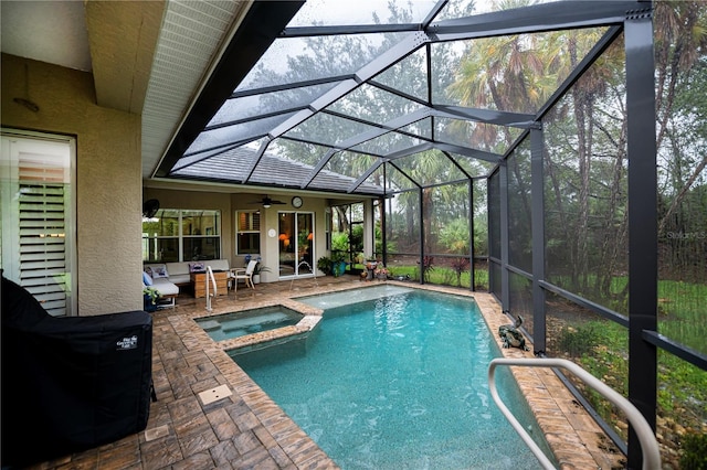 1062 Eagles Flight Way, North Port, FL 34287 - view of pool featuring a patio area, ceiling fan, a pool with connected hot tub, and a lanai