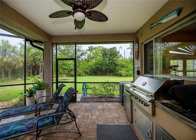 1062 Eagles Flight Way, North Port, FL 34287 - sunroom / solarium with a ceiling fan, healthy amount of natural light, and an outdoor kitchen