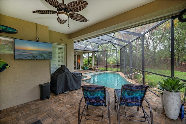 1062 Eagles Flight Way, North Port, FL 34287 - swimming pool with grilling area, a patio, a ceiling fan, and glass enclosure