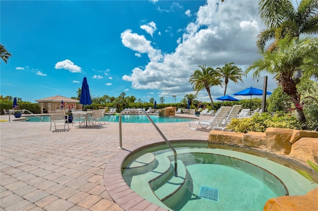 1062 Eagles Flight Way, North Port, FL 34287 - community pool with a hot tub and a patio