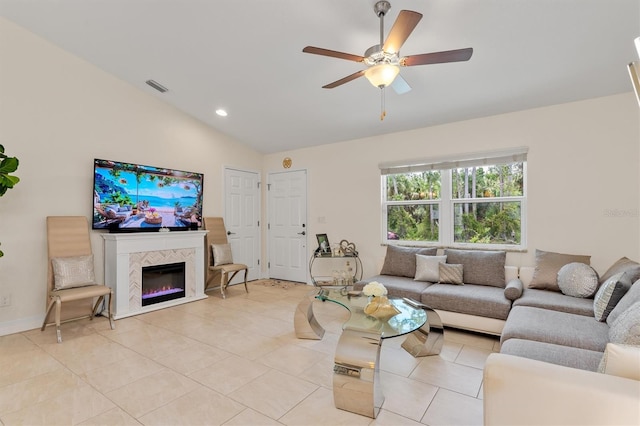 3138 Darius Ave, North Port, FL 34288 - living area featuring vaulted ceiling, ceiling fan, a tile fireplace, light tile patterned floors, and recessed lighting
