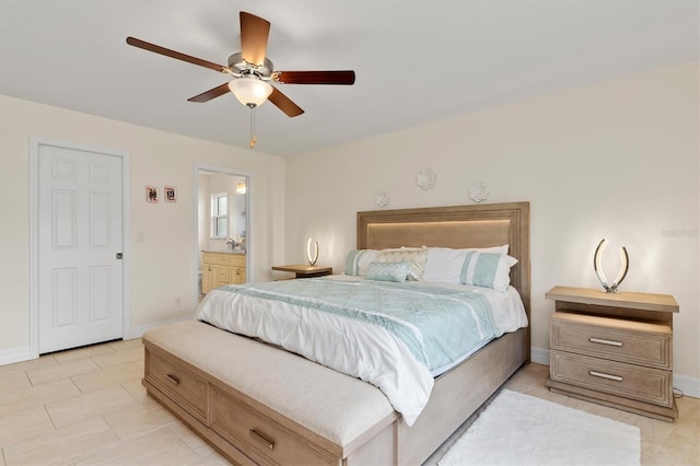 3138 Darius Ave, North Port, FL 34288 - bedroom with baseboards, ensuite bath, a ceiling fan, and light tile patterned flooring