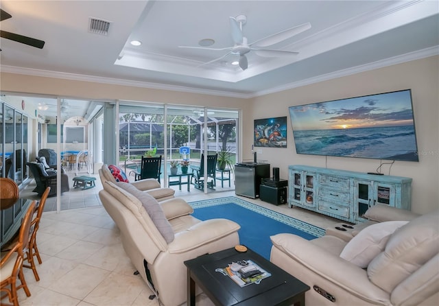 2387 Nuremberg Blvd, Punta Gorda, FL 33983 - living room with ceiling fan, a sunroom, crown molding, tile patterned flooring, and a tray ceiling