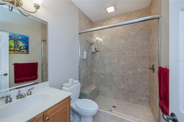 2387 Nuremberg Blvd, Punta Gorda, FL 33983 - full bathroom featuring vanity, a stall shower, and toilet