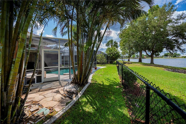 2387 Nuremberg Blvd, Punta Gorda, FL 33983 - view of yard with a water view, an outdoor pool, a patio area, and a lanai