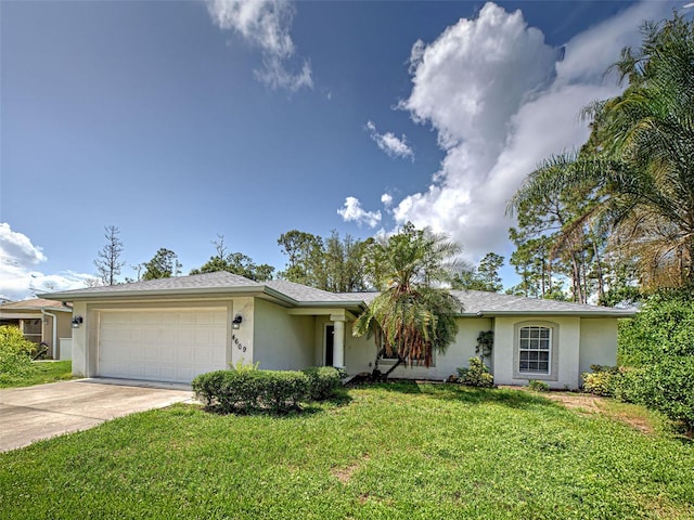 4609 Jaslo Ave, North Port, FL 34286 - single story home featuring stucco siding, an attached garage, and driveway