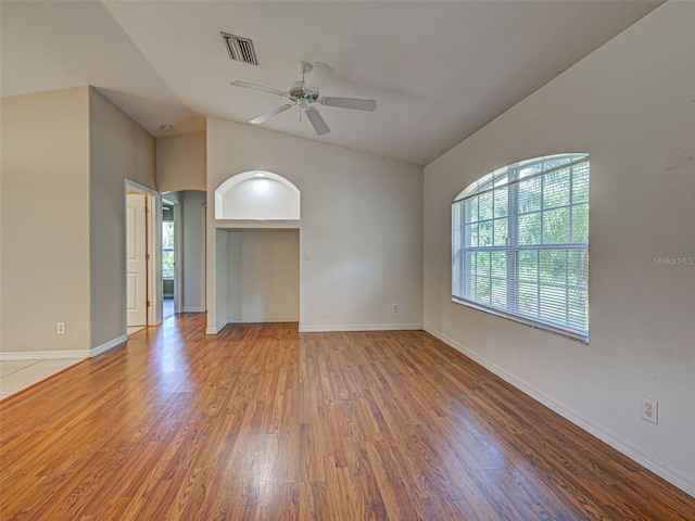 4609 Jaslo Ave, North Port, FL 34286 - spare room with wood finished floors, a ceiling fan, baseboards, and lofted ceiling
