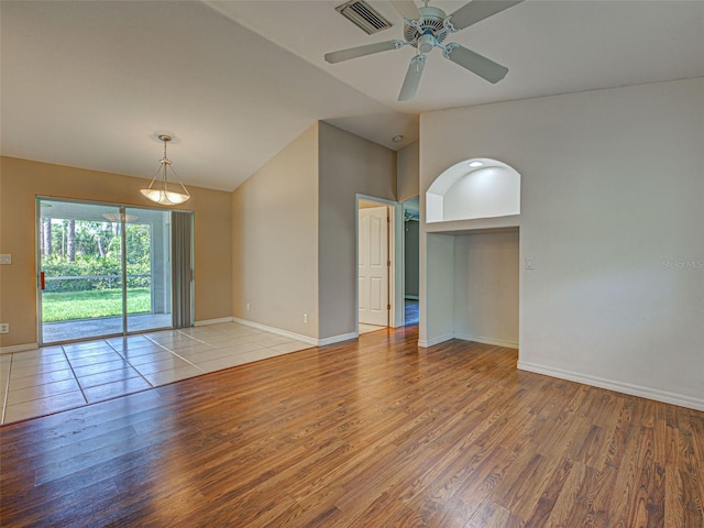 4609 Jaslo Ave, North Port, FL 34286 - spare room with light wood-style flooring, baseboards, a ceiling fan, and high vaulted ceiling
