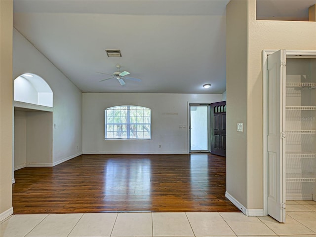 4609 Jaslo Ave, North Port, FL 34286 - unfurnished room featuring a ceiling fan, vaulted ceiling, wood finished floors, and baseboards