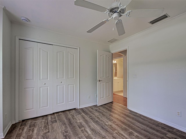 4609 Jaslo Ave, North Port, FL 34286 - unfurnished bedroom with wood finished floors, a closet, baseboards, ornamental molding, and a ceiling fan