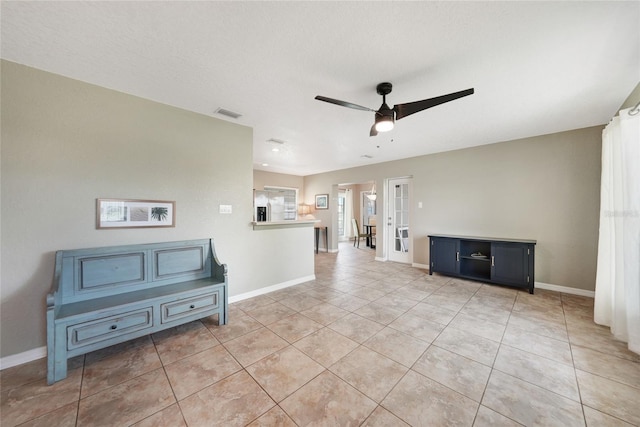 3171 Highlands Rd, Punta Gorda, FL 33983 - unfurnished living room featuring ceiling fan, light tile patterned floors, and french doors