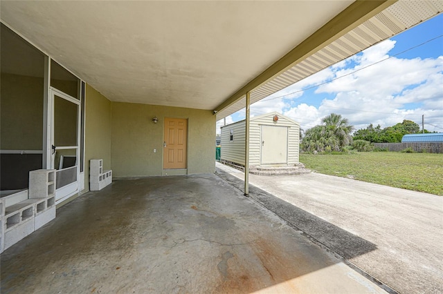 3171 Highlands Rd, Punta Gorda, FL 33983 - view of patio featuring a storage unit