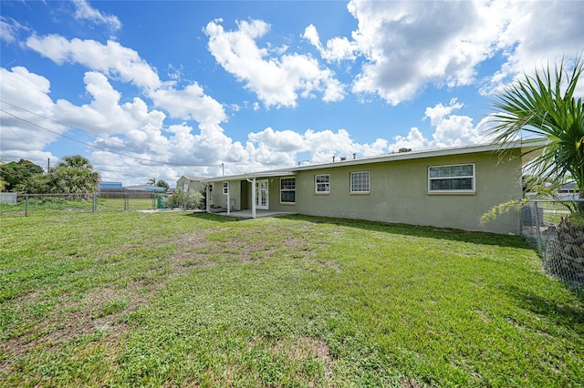 3171 Highlands Rd, Punta Gorda, FL 33983 - back of house featuring stucco siding, a fenced backyard, and a patio
