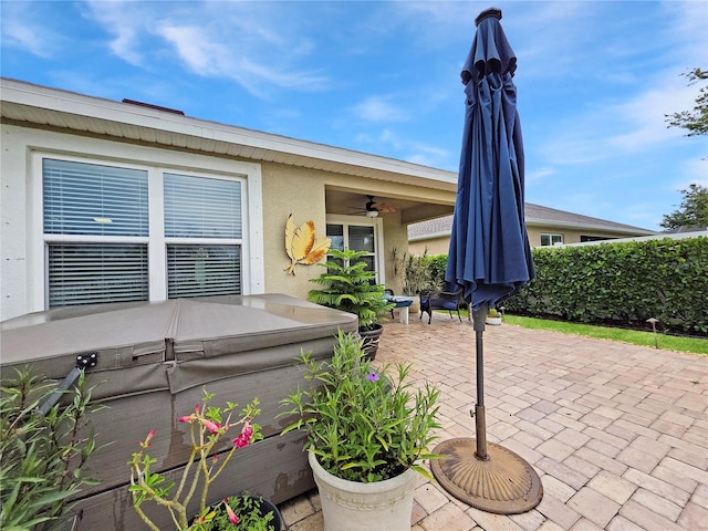 7292 Mikasa Dr, Punta Gorda, FL 33950 - view of patio with ceiling fan and a hot tub