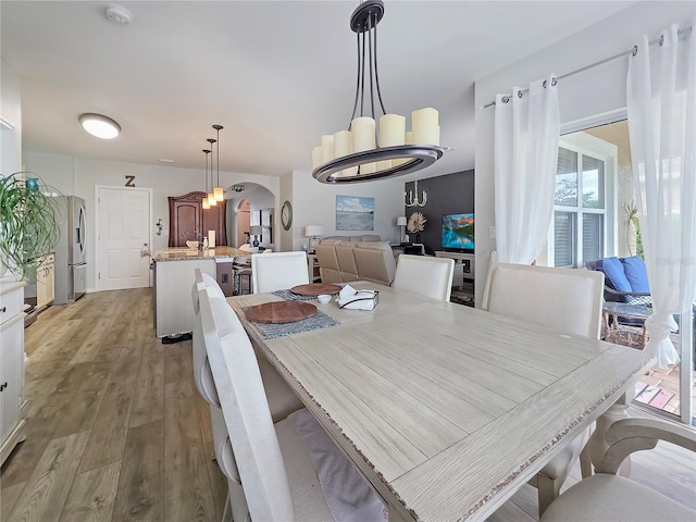 7292 Mikasa Dr, Punta Gorda, FL 33950 - dining space with wood finished floors and arched walkways
