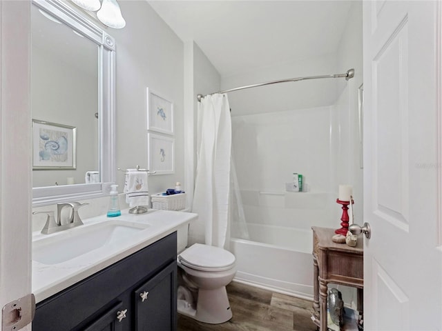 7292 Mikasa Dr, Punta Gorda, FL 33950 - full bath featuring vanity, toilet, wood finished floors, and shower / bath combo