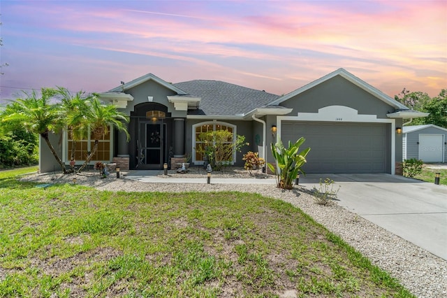 1444 Frisco Ter, Port Charlotte, FL 33953 - ranch-style house featuring stucco siding, an attached garage, driveway, and a lawn