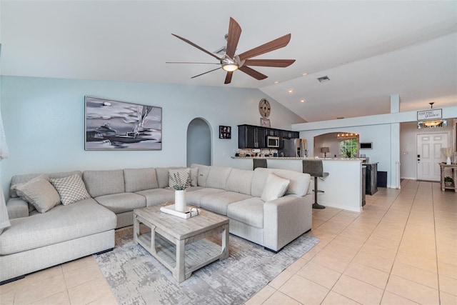 1444 Frisco Ter, Port Charlotte, FL 33953 - living area with arched walkways, vaulted ceiling, ceiling fan, and light tile patterned floors