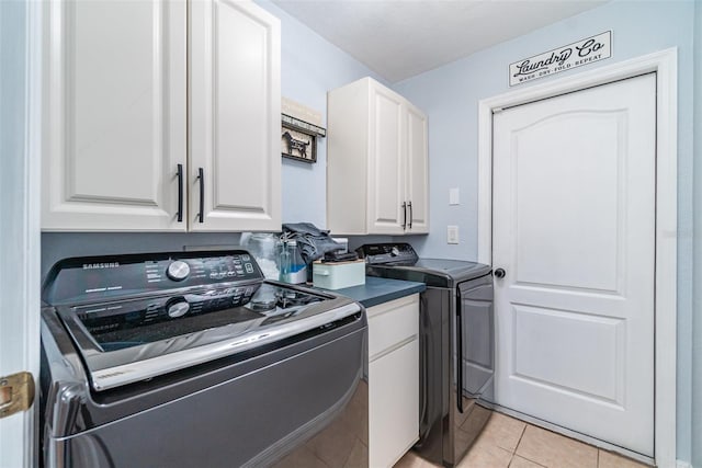 1444 Frisco Ter, Port Charlotte, FL 33953 - washroom featuring cabinet space, washer and dryer, and light tile patterned floors
