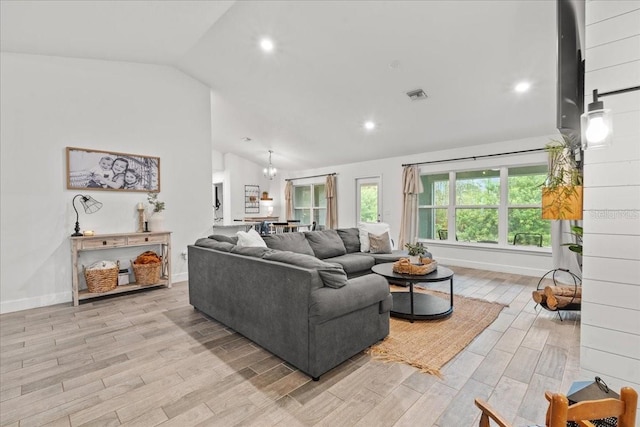 5436 Jessamine Ave, North Port, FL 34291 - living area with light wood-type flooring, baseboards, recessed lighting, and high vaulted ceiling