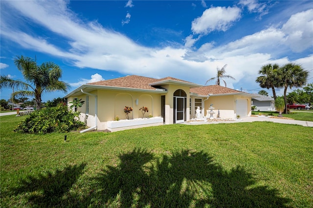1 Sportsman Cir, Rotonda West, FL 33947 - view of front of house with stucco siding, a garage, a front yard, and concrete driveway
