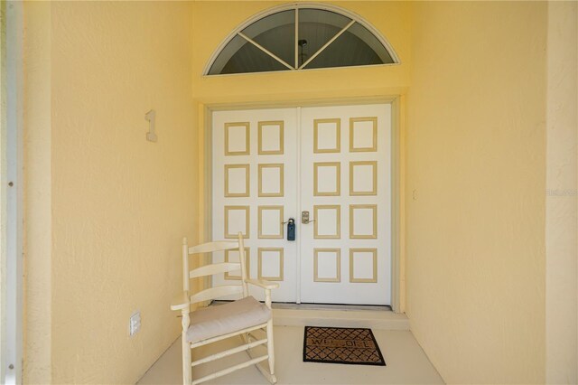 1 Sportsman Cir, Rotonda West, FL 33947 - property entrance with stucco siding