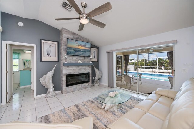 1 Sportsman Cir, Rotonda West, FL 33947 - living area with lofted ceiling, a ceiling fan, a fireplace, and tile patterned flooring