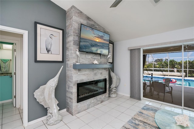 1 Sportsman Cir, Rotonda West, FL 33947 - living area with lofted ceiling, a large fireplace, tile patterned floors, and ceiling fan