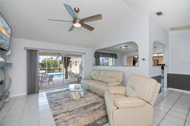1 Sportsman Cir, Rotonda West, FL 33947 - living area featuring light tile patterned floors, ceiling fan, arched walkways, and high vaulted ceiling