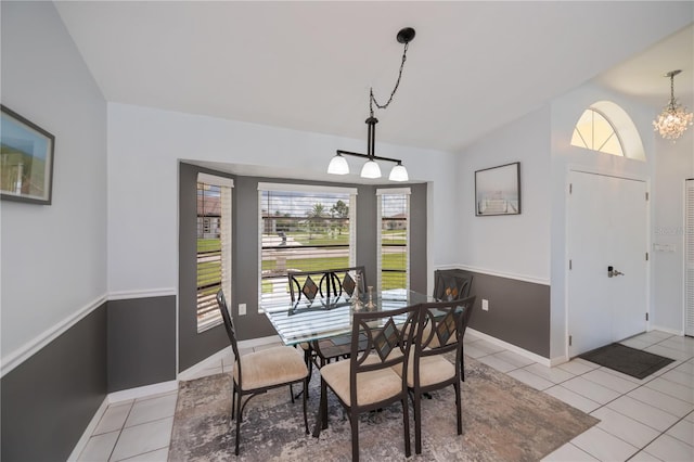 1 Sportsman Cir, Rotonda West, FL 33947 - dining area featuring light tile patterned flooring, lofted ceiling, and a chandelier