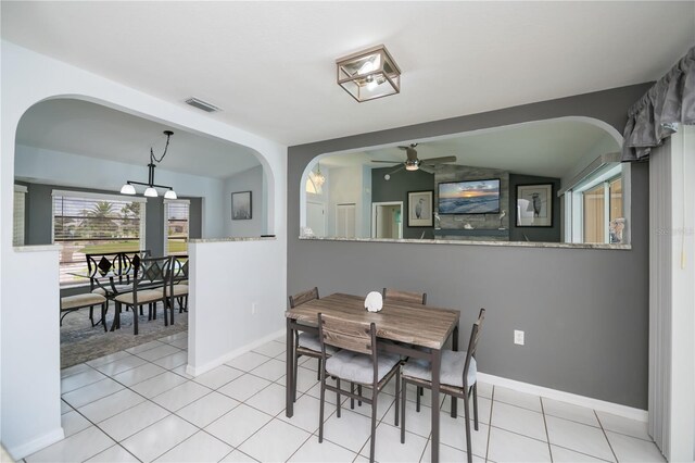 1 Sportsman Cir, Rotonda West, FL 33947 - tiled dining room featuring a ceiling fan and arched walkways