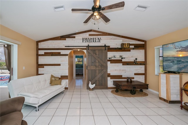 1 Sportsman Cir, Rotonda West, FL 33947 - living area featuring wooden walls, a barn door, lofted ceiling, plenty of natural light, and ceiling fan