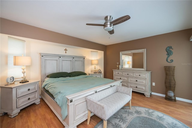1 Sportsman Cir, Rotonda West, FL 33947 - bedroom with light wood-type flooring and ceiling fan