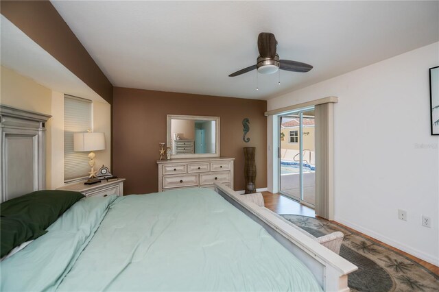 1 Sportsman Cir, Rotonda West, FL 33947 - bedroom with access to exterior, wood finished floors, and ceiling fan