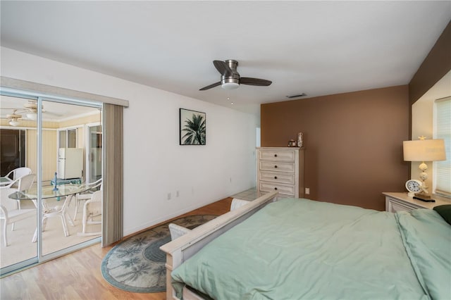 1 Sportsman Cir, Rotonda West, FL 33947 - bedroom with access to outside, wood finished floors, and a ceiling fan