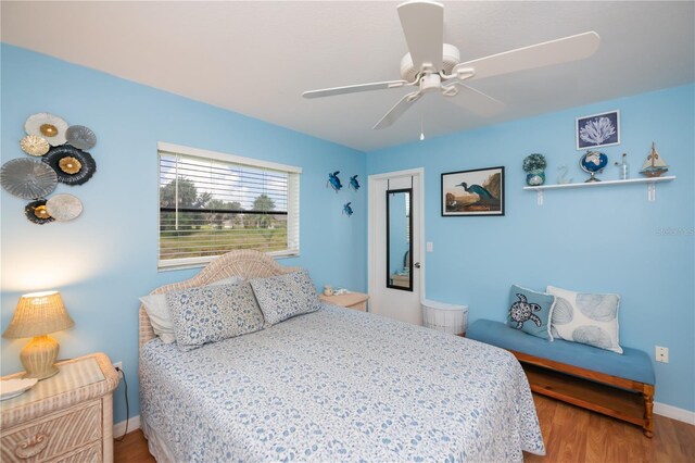 1 Sportsman Cir, Rotonda West, FL 33947 - bedroom featuring wood finished floors and ceiling fan