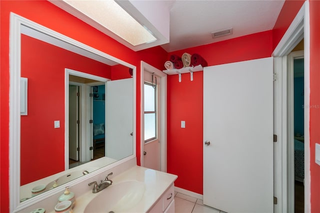 1 Sportsman Cir, Rotonda West, FL 33947 - bathroom with vanity, tile patterned flooring, and ensuite bathroom